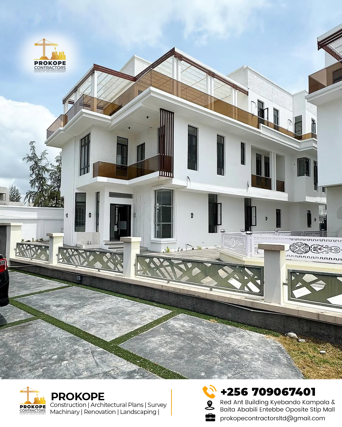 Completed three-storey white house with bronze glass balustrades, a covered roof terrace and a patterned perimeter fence